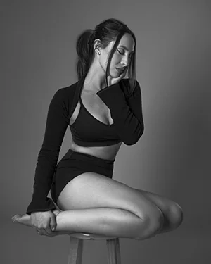 Ariana Grande inspired blackwhite fitness model stool pose bw